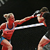 Holly Holm (white top) vs. Jan Finney