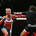 Holly Holm (white top) vs. Jan Finney