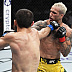 Islam Makhachev def. Charles Oliveira R2 3:16 via Submission (Arm-Triangle Choke)