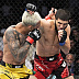 Islam Makhachev def. Charles Oliveira R2 3:16 via Submission (Arm-Triangle Choke)