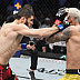 Islam Makhachev def. Charles Oliveira R2 3:16 via Submission (Arm-Triangle Choke)